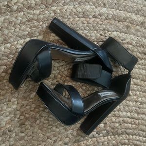 Steve Madden black leather platform heel.